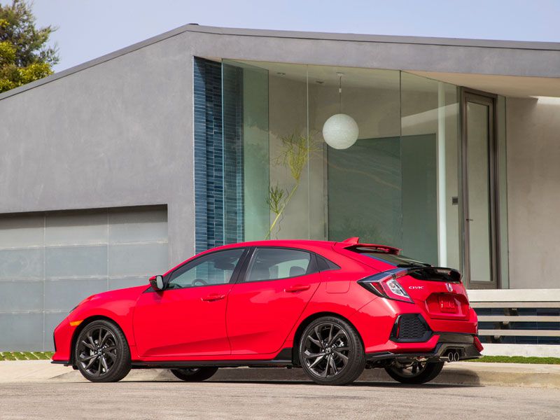 2017 Honda Civic Hatchback parked in front of house ・  Photo by Honda 