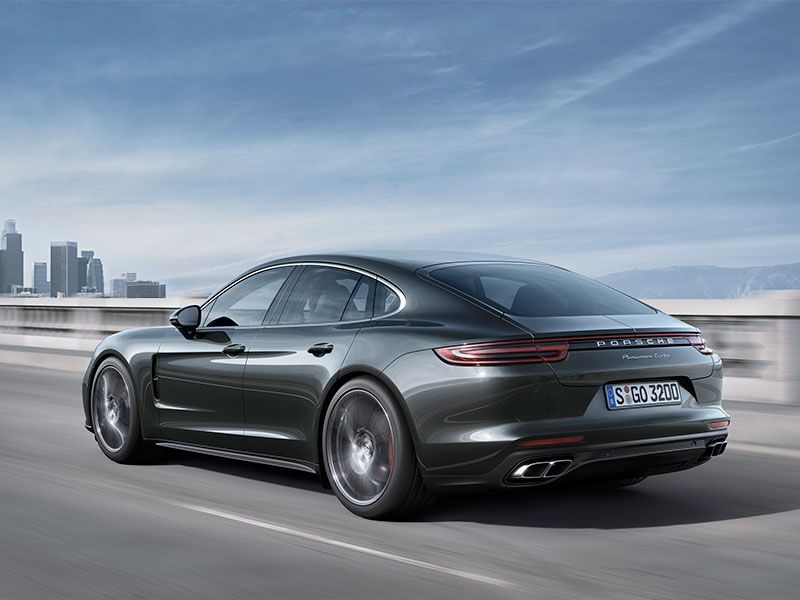 2017 Porsche Panamera rear view on road ・  Photo by Porsche 