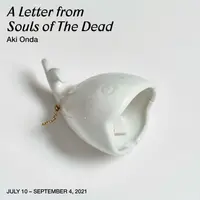 image oh white ceramic whale bell on white background. Blac text reads 