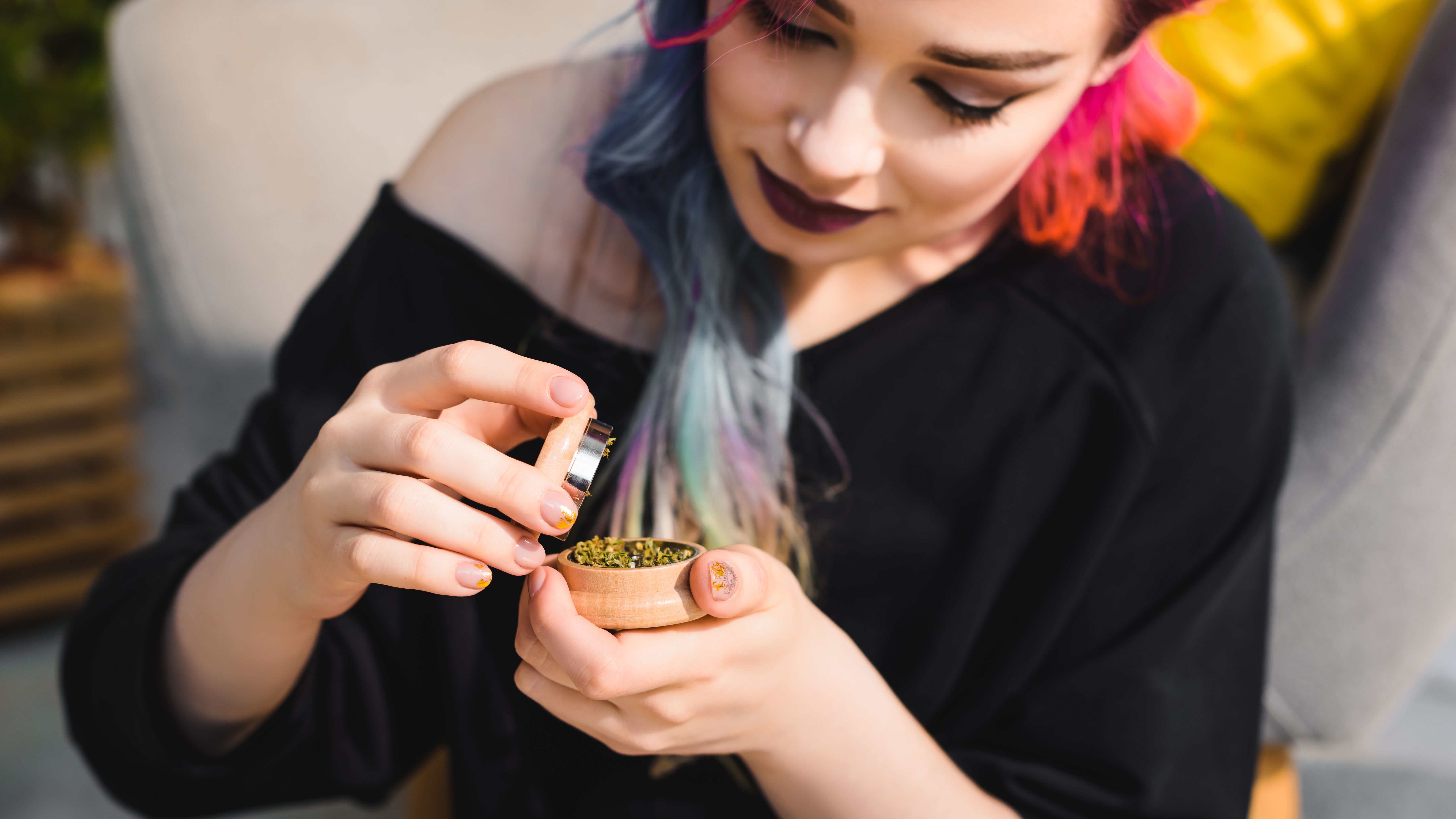 beautiful-girl-with-colorful-hair-holding-and-look-2024-11-10-23-21-04-utc.jpg