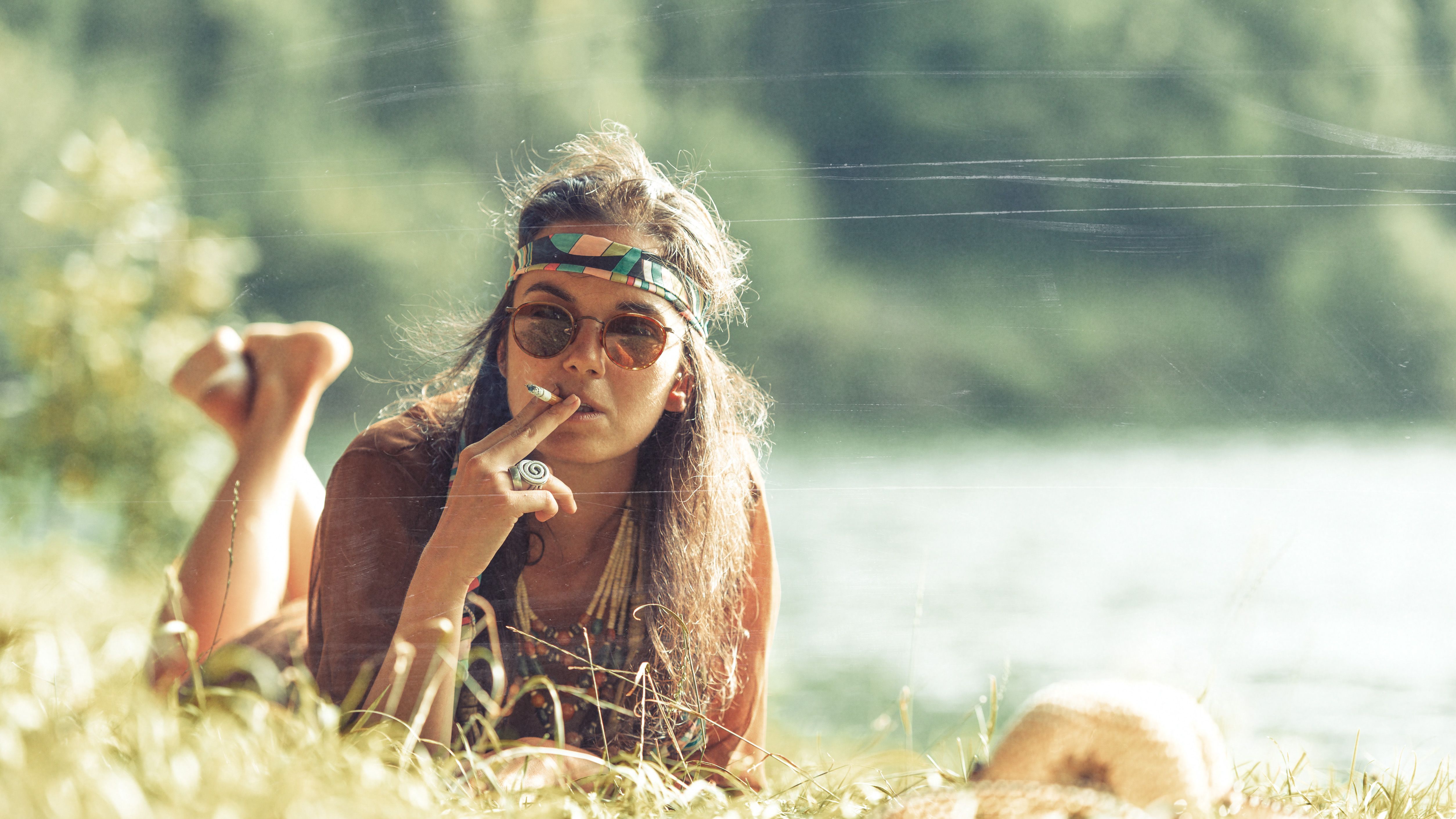 pretty-free-hippie-girl-smoking-on-the-grass-vin-2025-03-07-16-44-39-utc.jpg