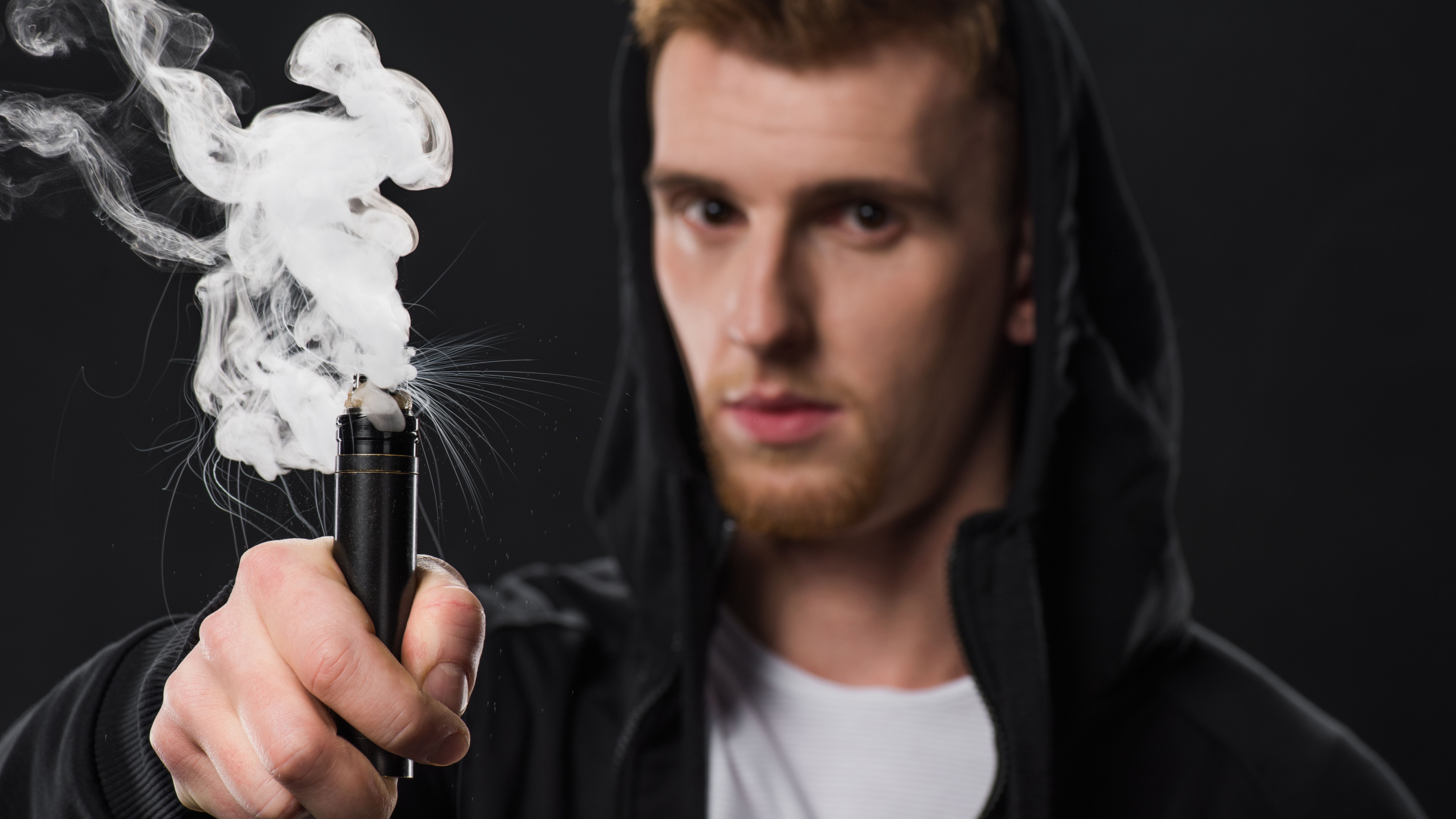 young-bearded-man-activating-electronic-cigarette-2024-11-18-11-12-22-utc.jpg