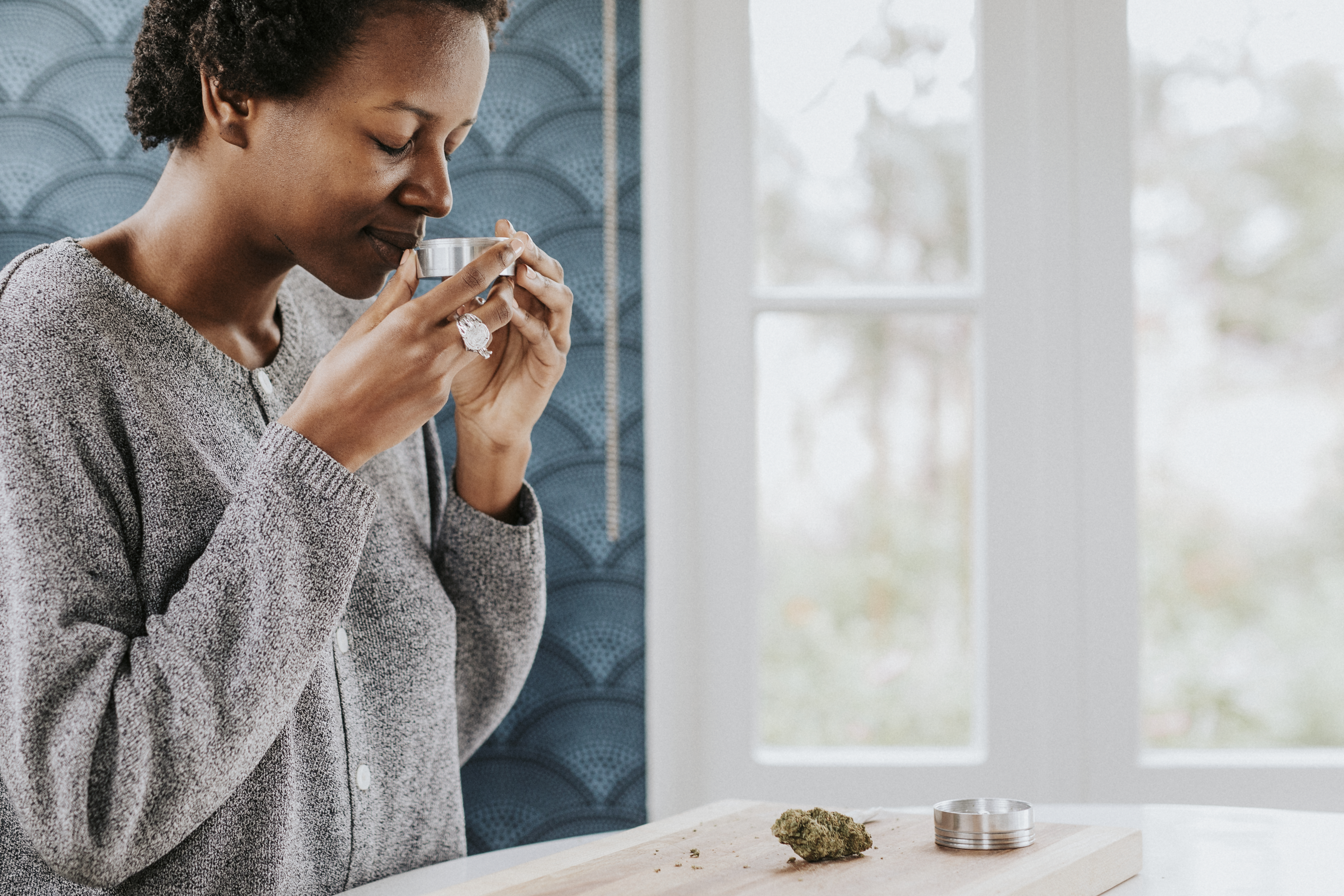 african-woman-smelling-a-weed-2025-02-10-00-03-34-utc.jpg