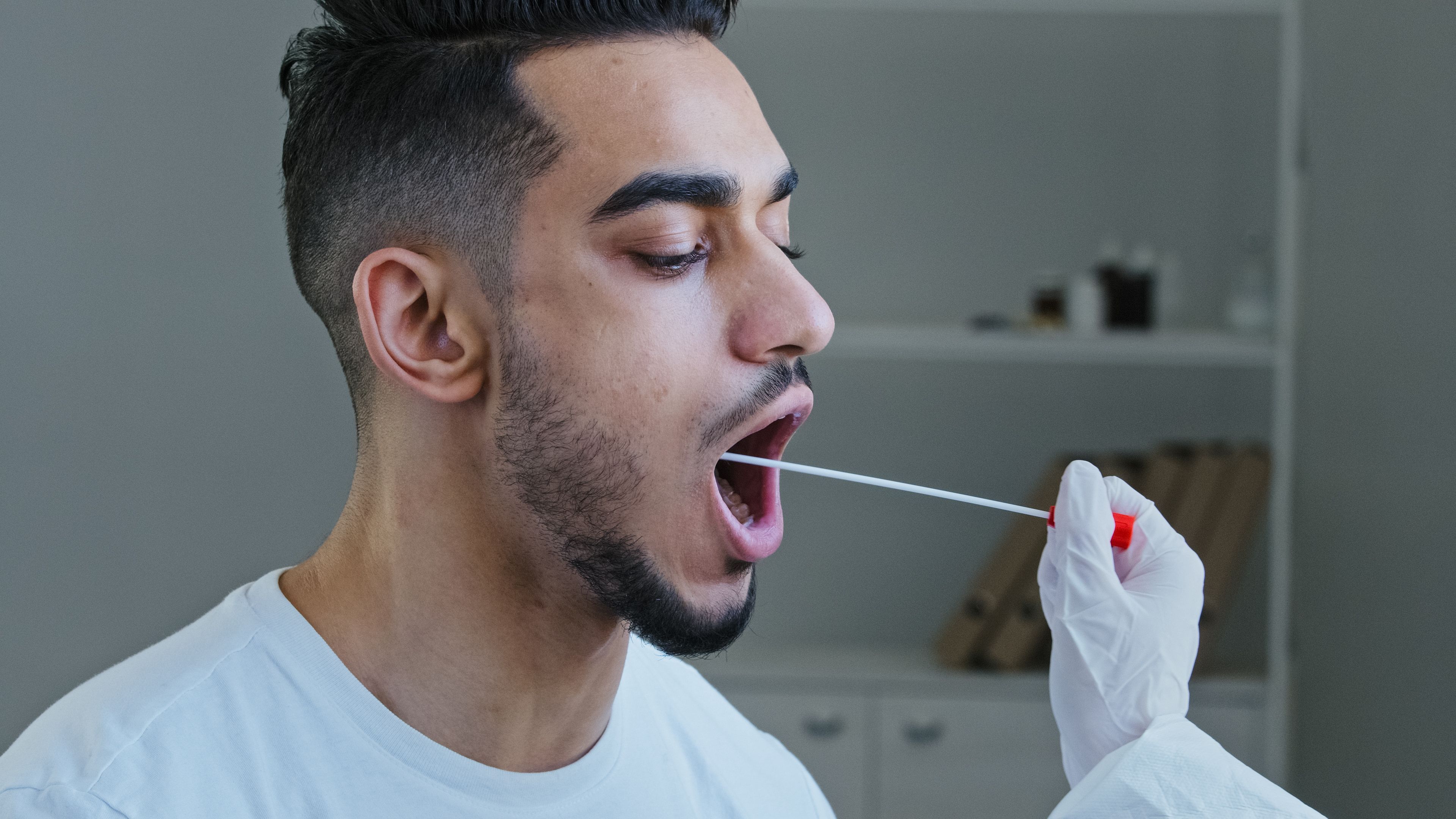 close-up-spanish-man-arabic-male-patient-opens-mou-2025-03-24-00-51-25-utc.jpg