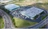 Large production facility with full parking lot areal view 