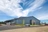 Jackson Family Wines exterior. Large blue metal building with stone and wood front entrance. 