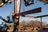 Workers on lifts at steel building construction site