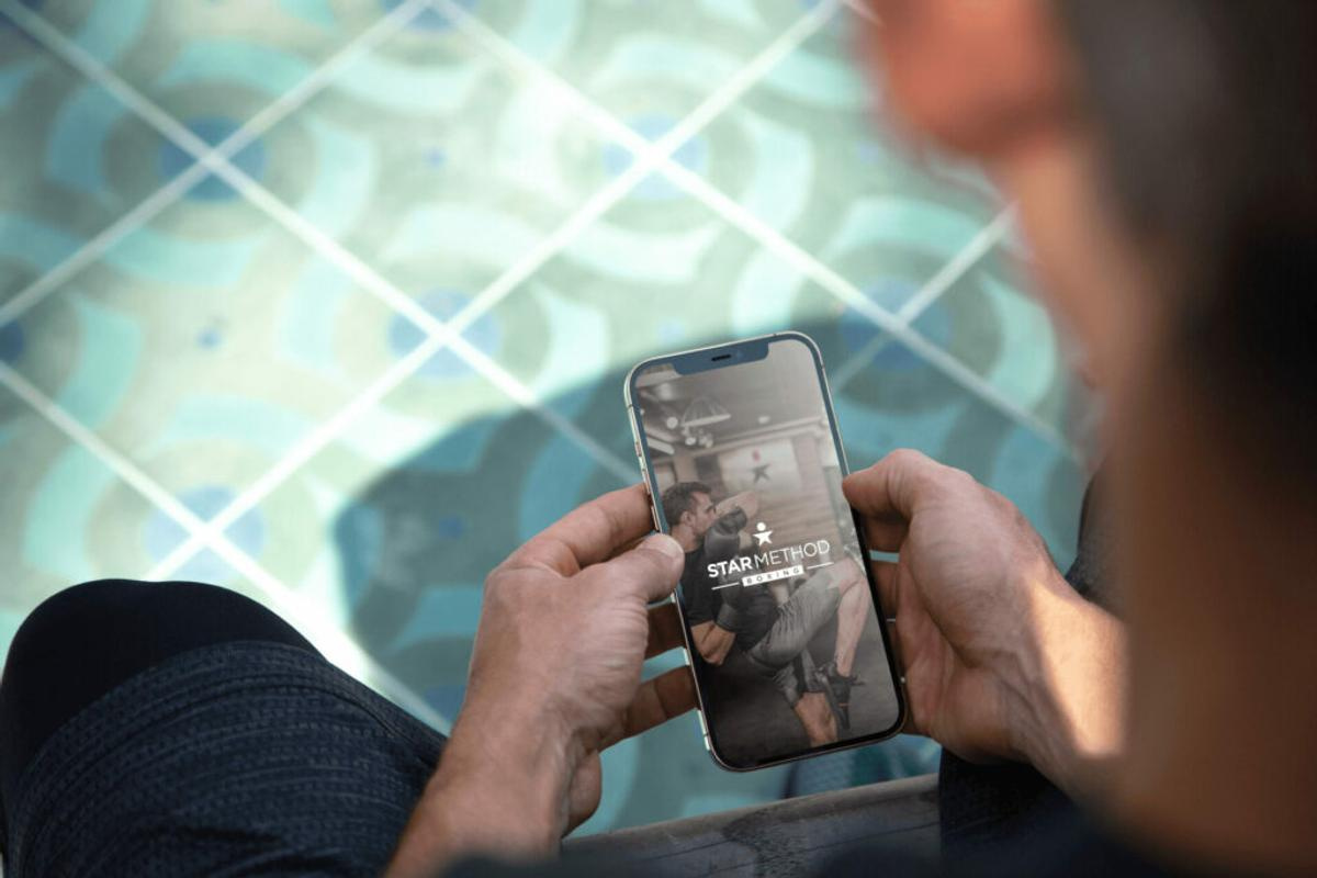 mobile phone with business website on screen