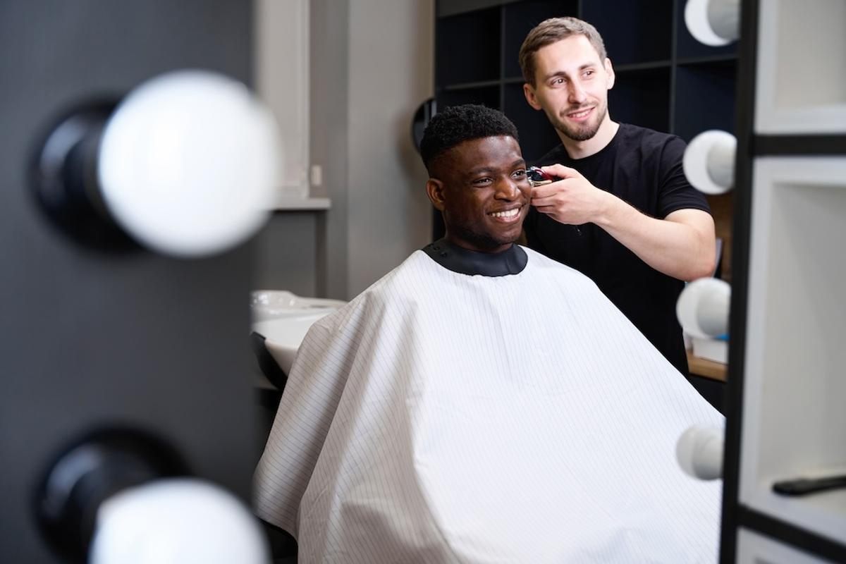 hairdresser-and-african-american-client-sit-in-fro-2025-03-05-08-36-35-utc.jpg