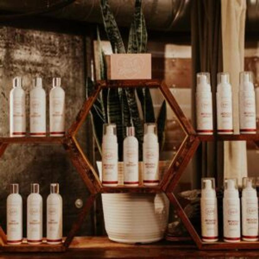 Wall of tanning mousse at OATS SLO tanning & airbrush salon