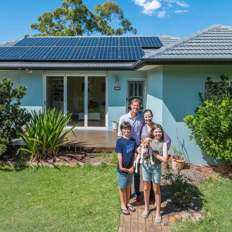 Family outside their electrified home