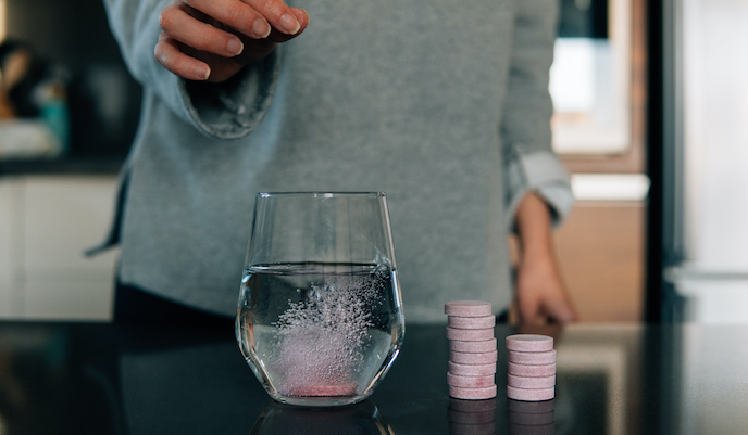 Vitamin tablet dissolving in water.jpg