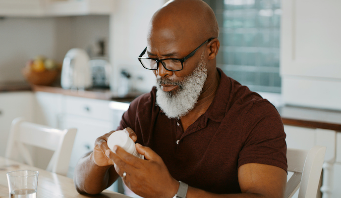 Man reading antibiotics prescription.jpg