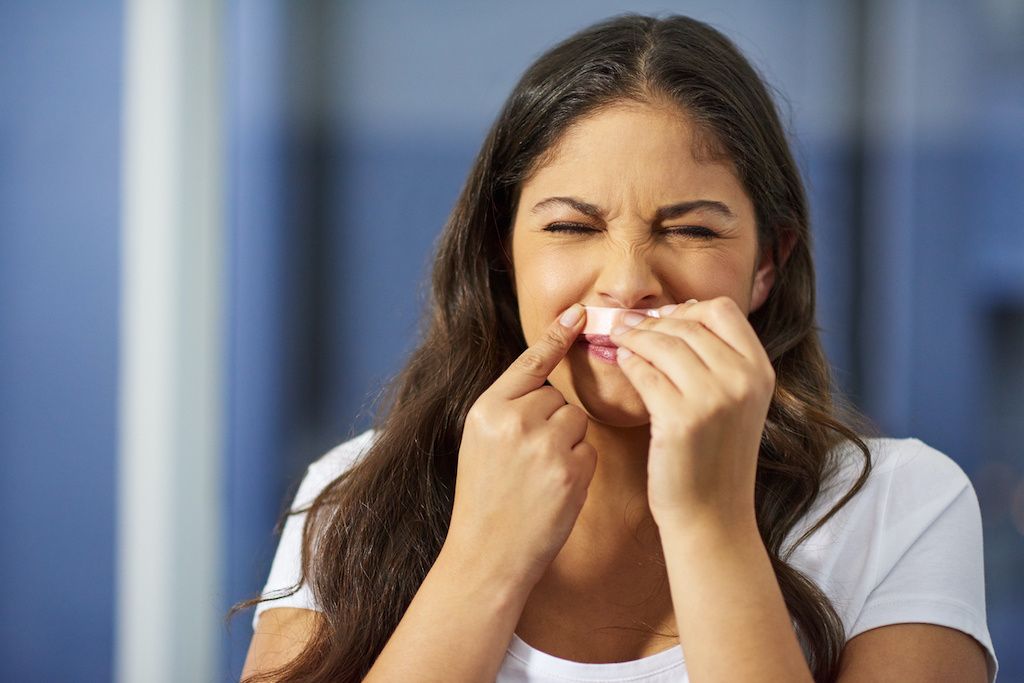 A woman waxing her lip