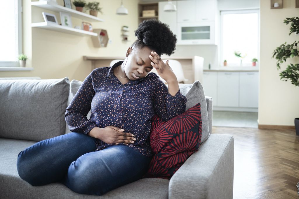 A woman experiencing diarrhea symptoms