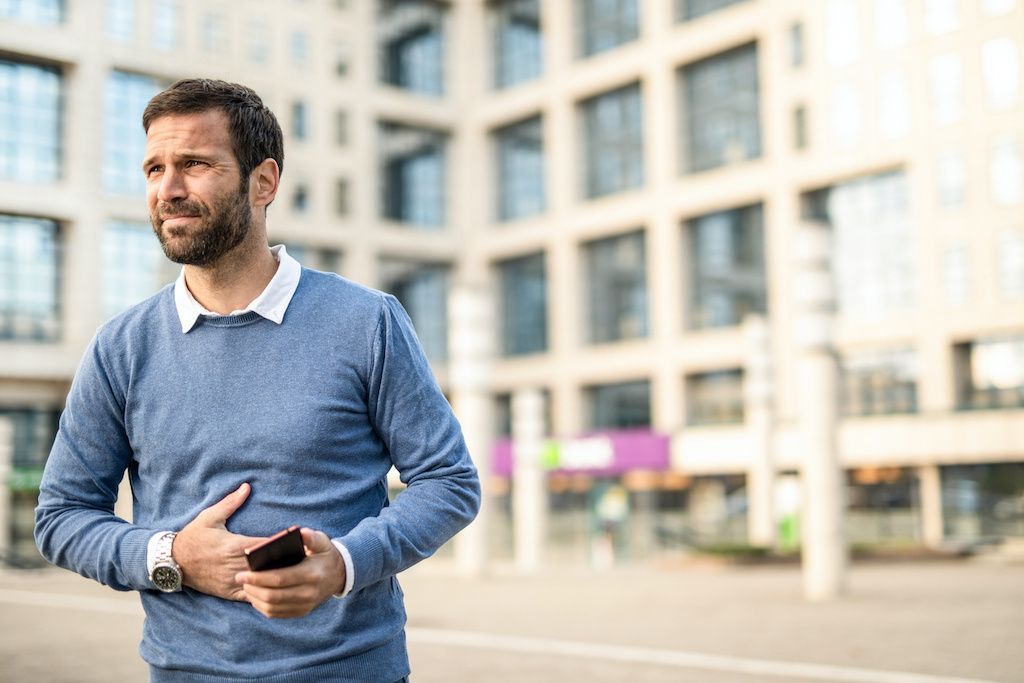 A man experiencing constipation symptoms