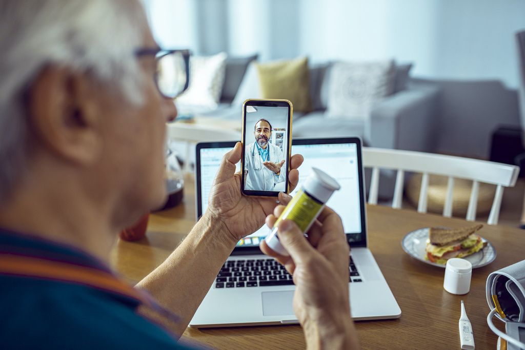 A man on a telemedicine call asking about his prescription