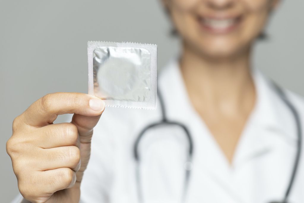 doctor-holding-condom.jpg
