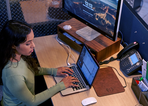 woman works on film production residuals in a studio office