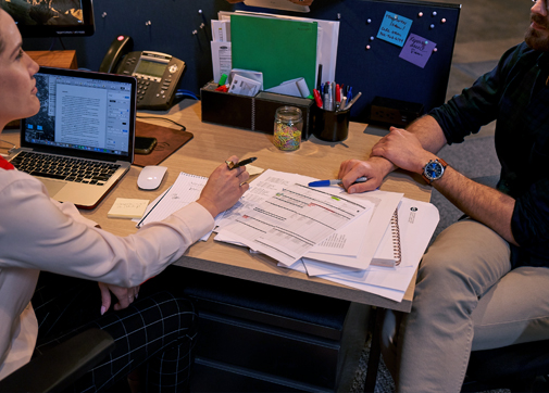 producers working on film project financing at a desk