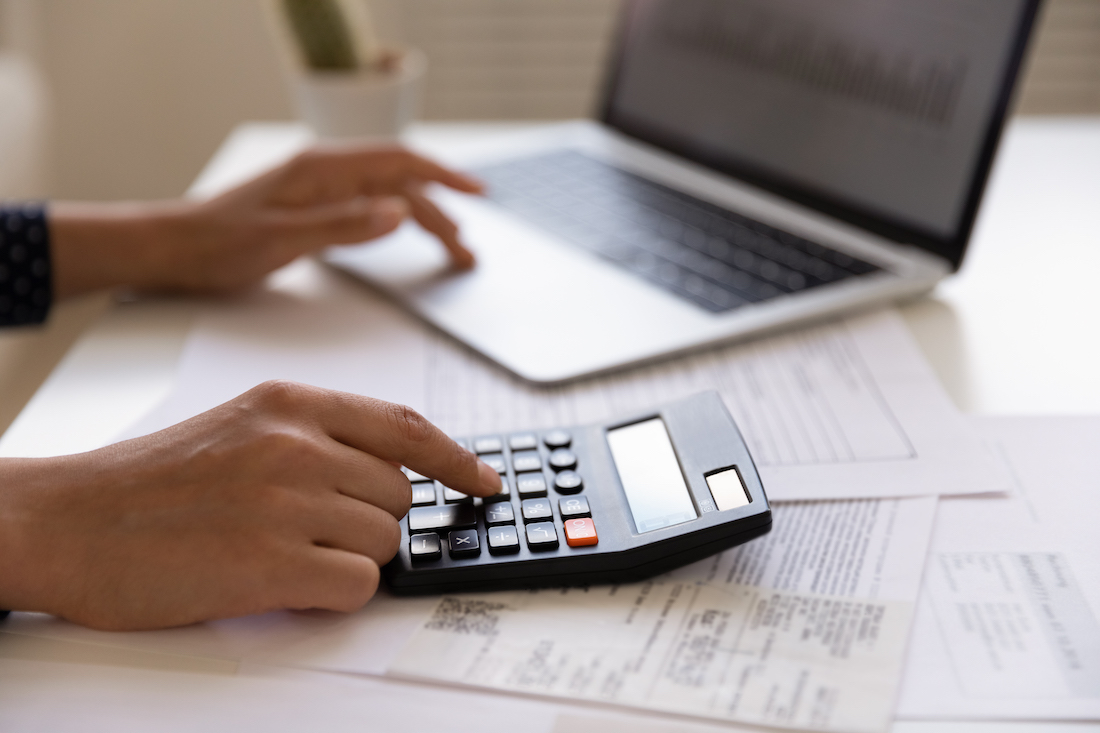 african american person using calculator.jpg