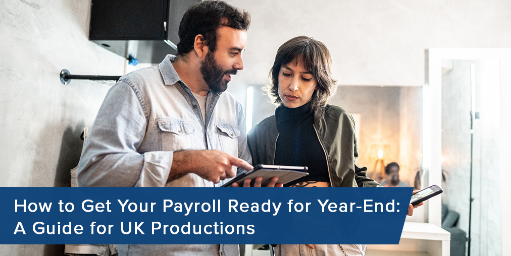 Payroll accountants review year-end payroll on UK production