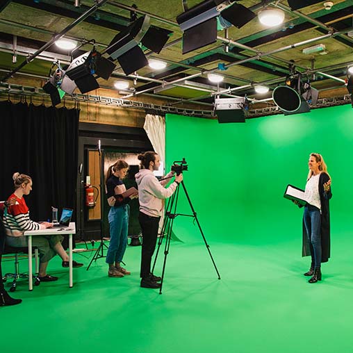 Film crew on a green screen set
