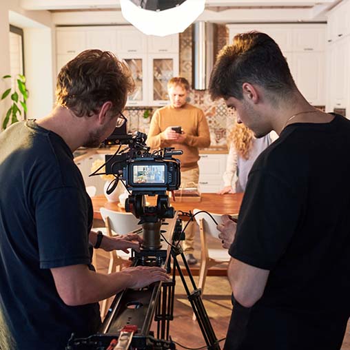 videographers adjusting video camera on production set-production incentives update March 2026