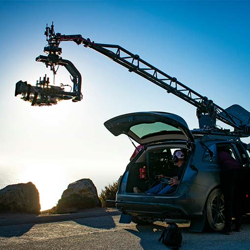 Location scout with camera on outdoor film shoot