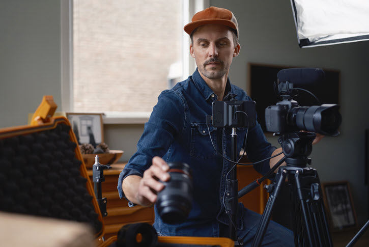 Crew member reviewing camera equipment