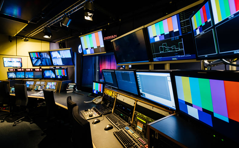 Broadcast TV control room with multiple screens