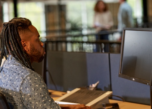 Production worker in the office on the computer