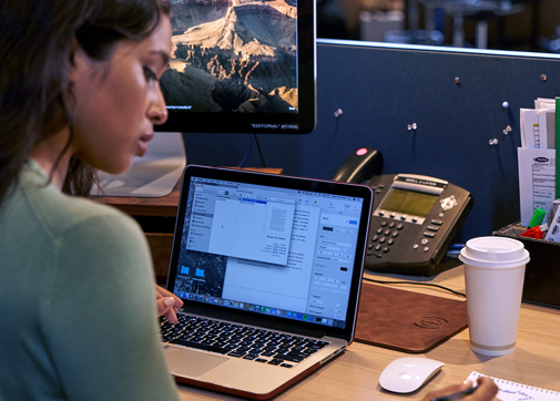film producer working at a laptop on financing a feature film