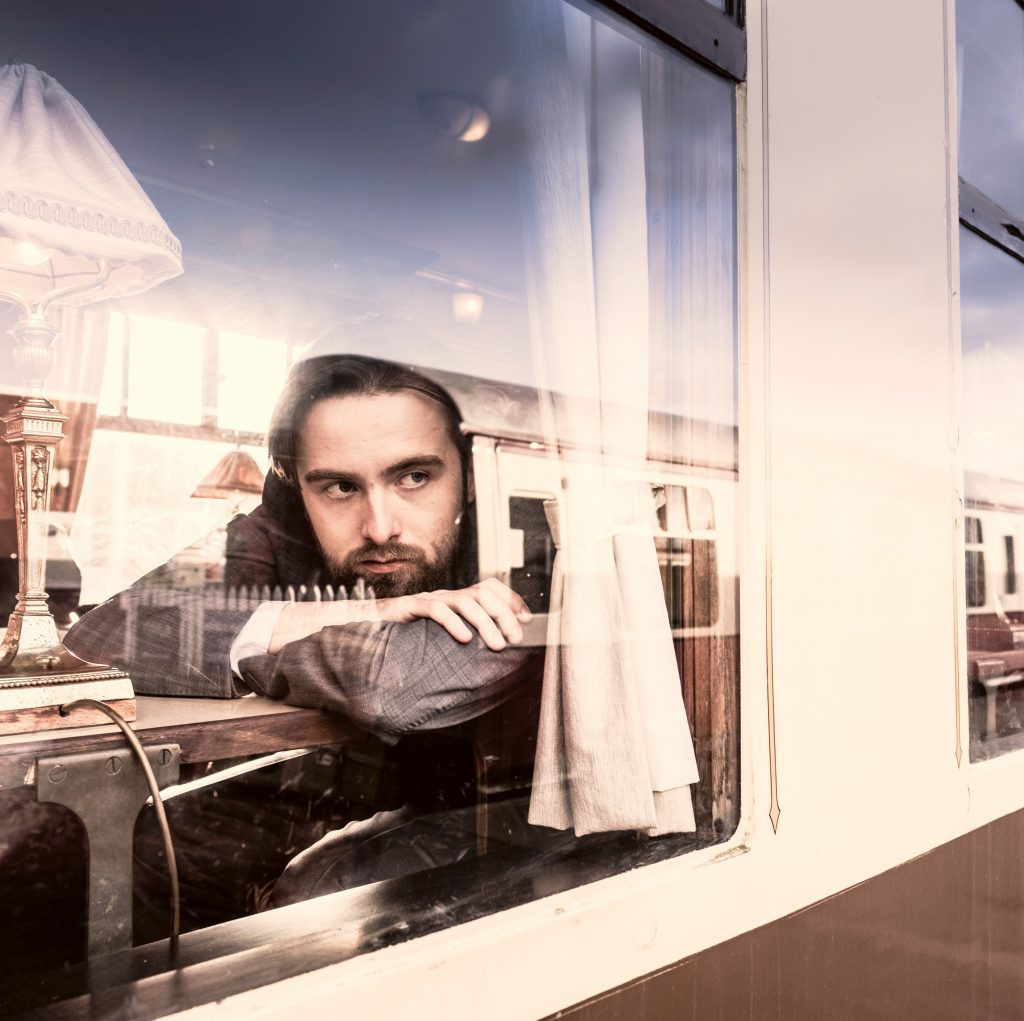 Daniil Trifonov looking out the window on a train. 