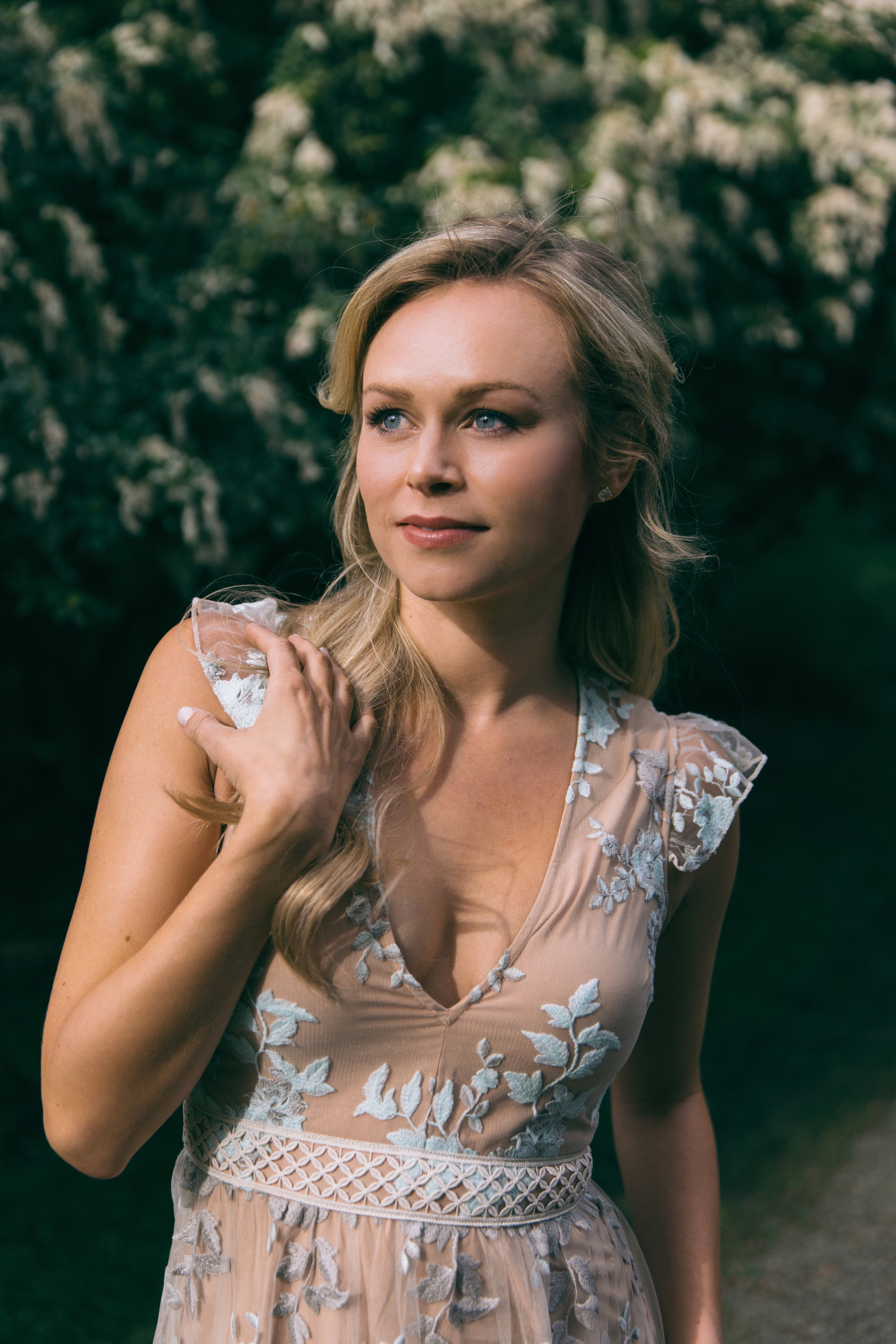 Deanna Breiwick posing in a garden. 