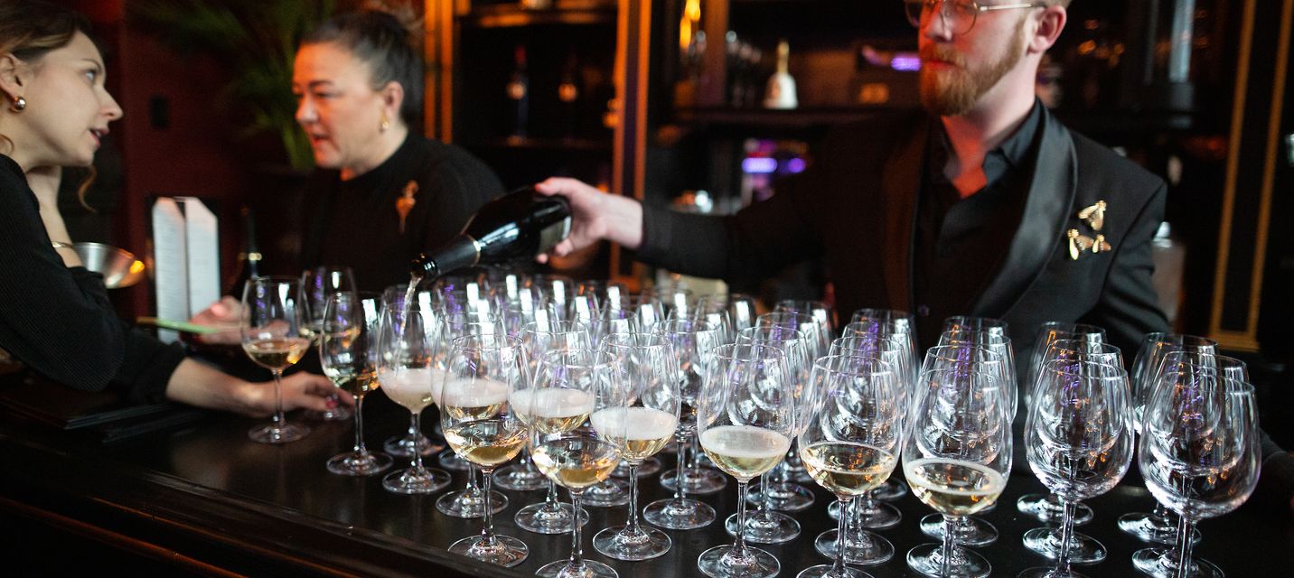 Glasses of Champagne being poured at an event