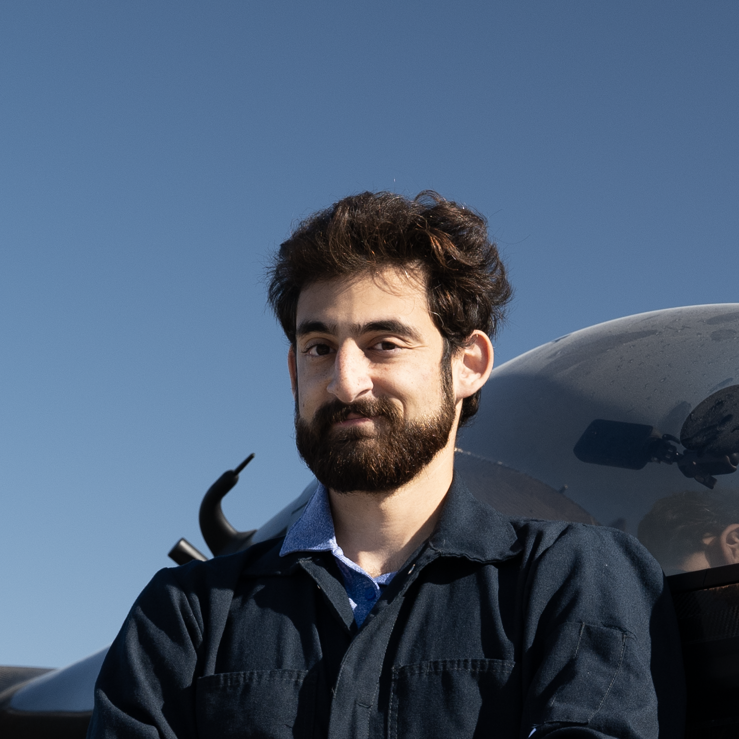 Pivotal pilot and engineer Adam Hacker poses in front of aircraft