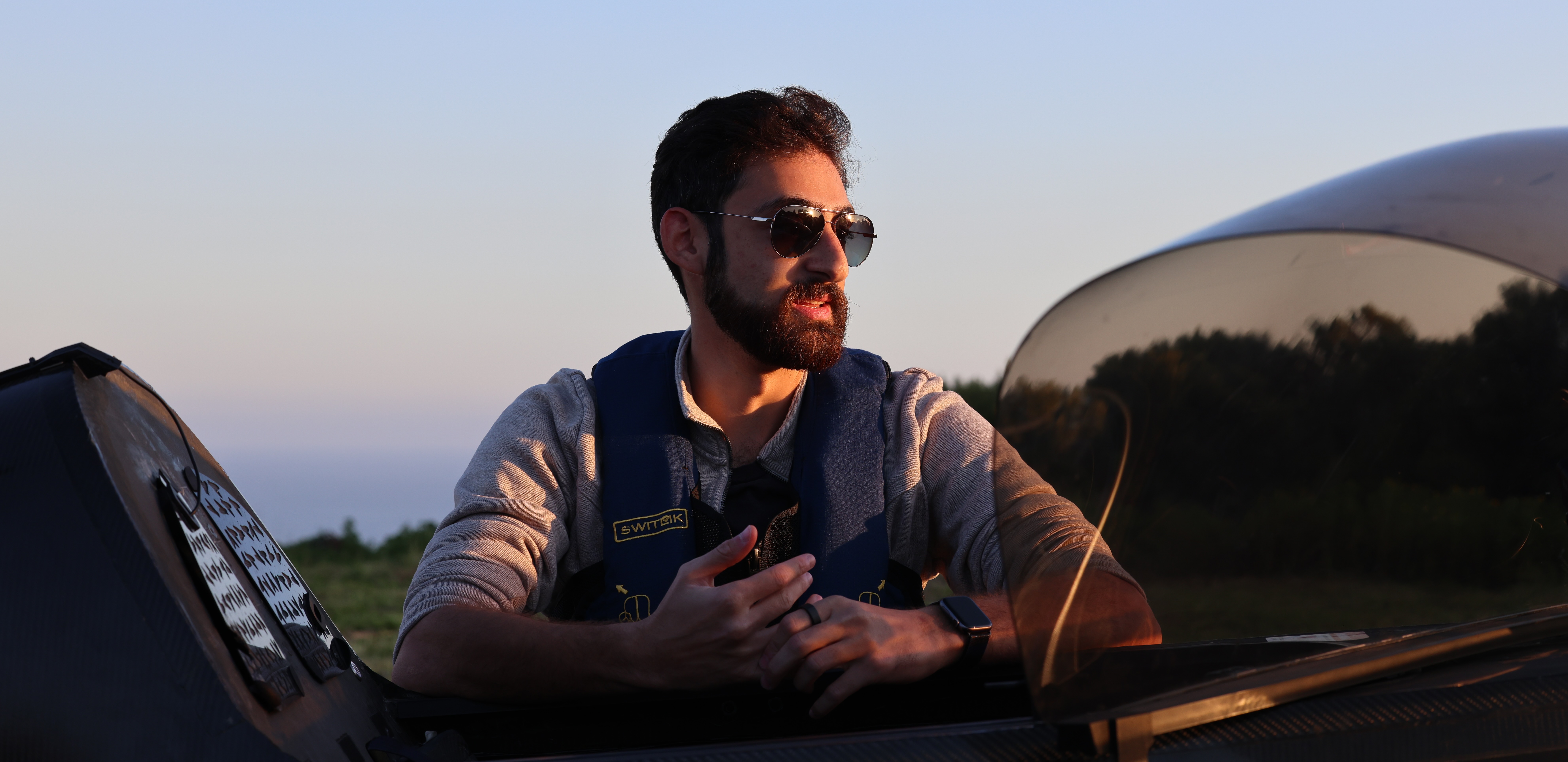 Pivotal pilot and engineer Adam Hacker behind aircraft