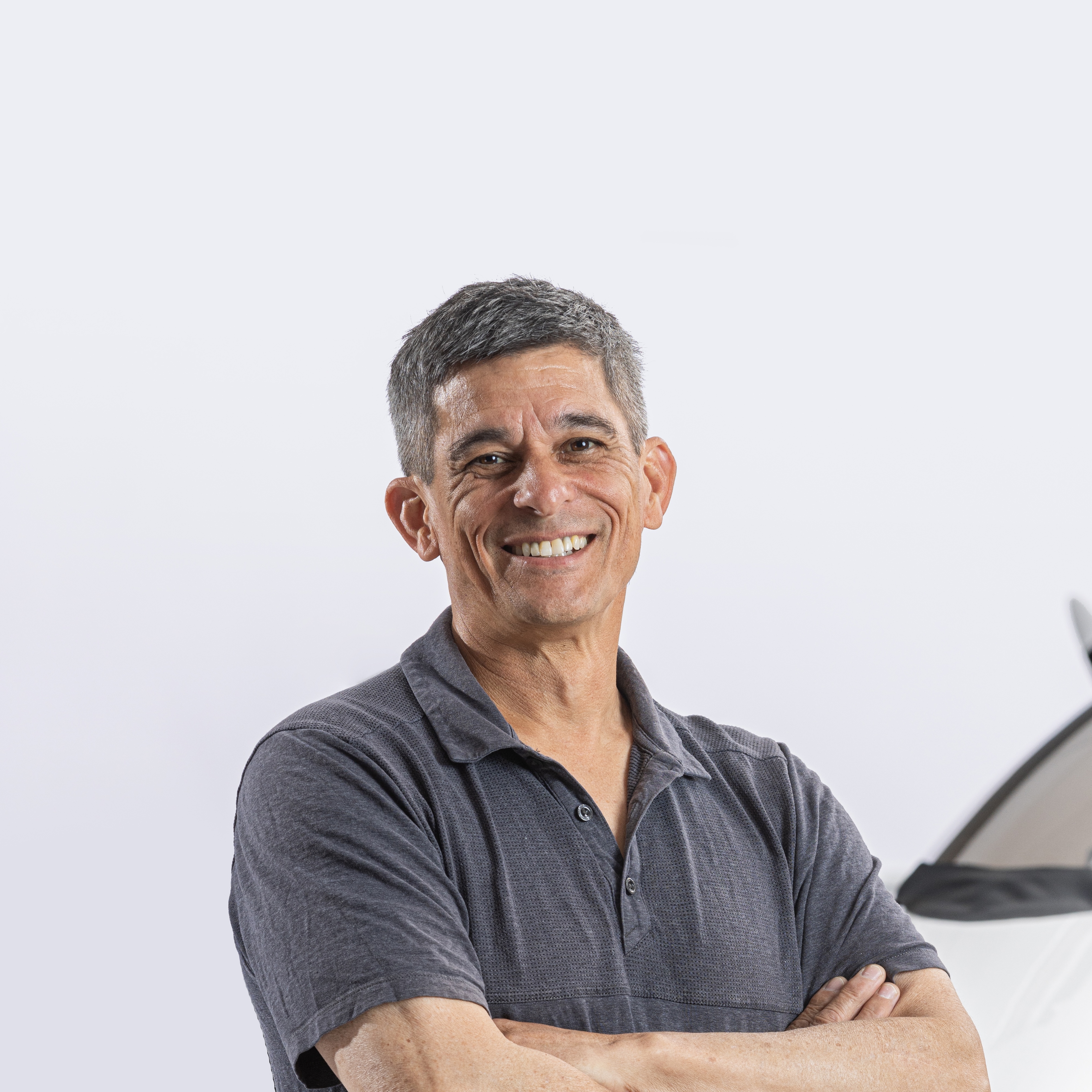 Pivotal pilot Tim Lum poses in front of Helix aircraft.