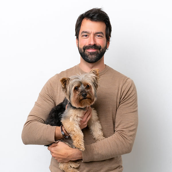 A man with a small dog