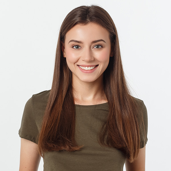 A woman in a green shirt smiling