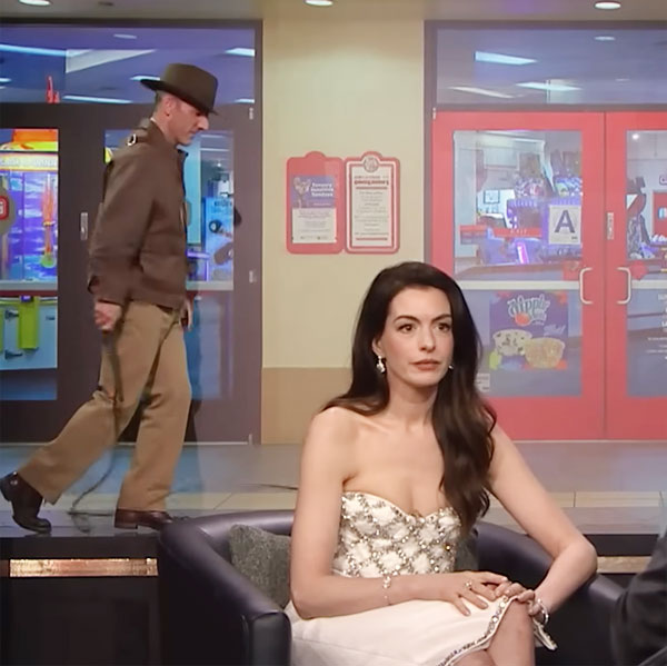 Background actor Rob Stats performing behind Anne Hathaway on The Tonight Show with Jimmy Fallon