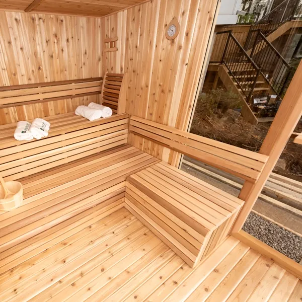 Pure Cube sauna interior with wide cedar benches and integrated backrest