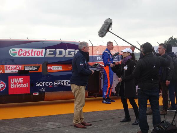 Technician inspecting Gems sensor installation.