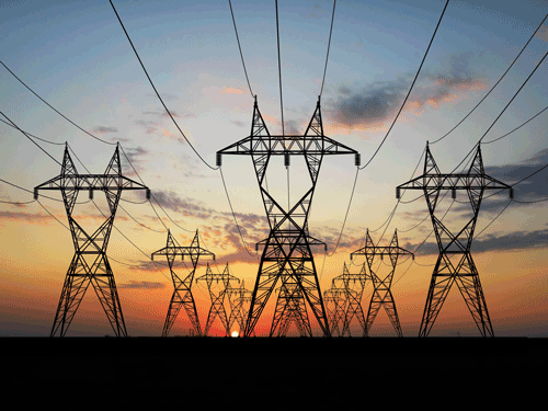High voltage transmission lines during sunrise