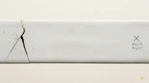 Cracked white ceramic marked for repair representing relationship conflict resolution, couples therapy, and the choice between LoveFix vs BetterHelp to mend broken communication.