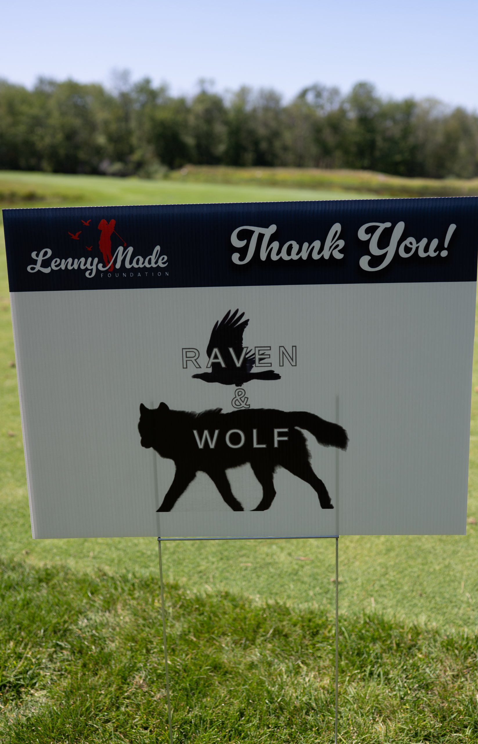 A LennyMade Foundation Thank You sponsor sign for Raven and Wolf, with raven and wolf silhouettes.
