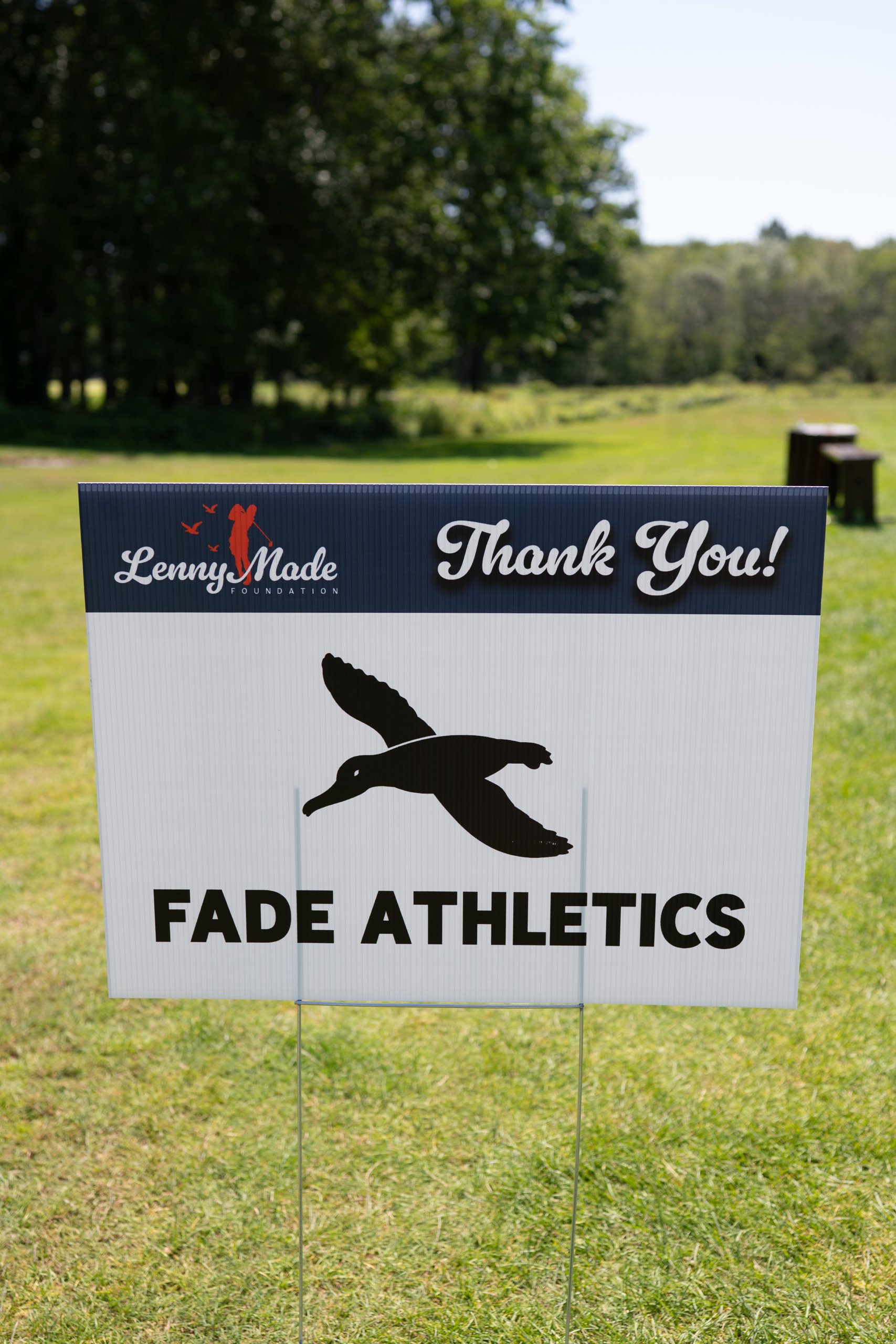 A LennyMade Foundation Thank You sponsor sign for Fade Athletics, with its flying-duck logo.