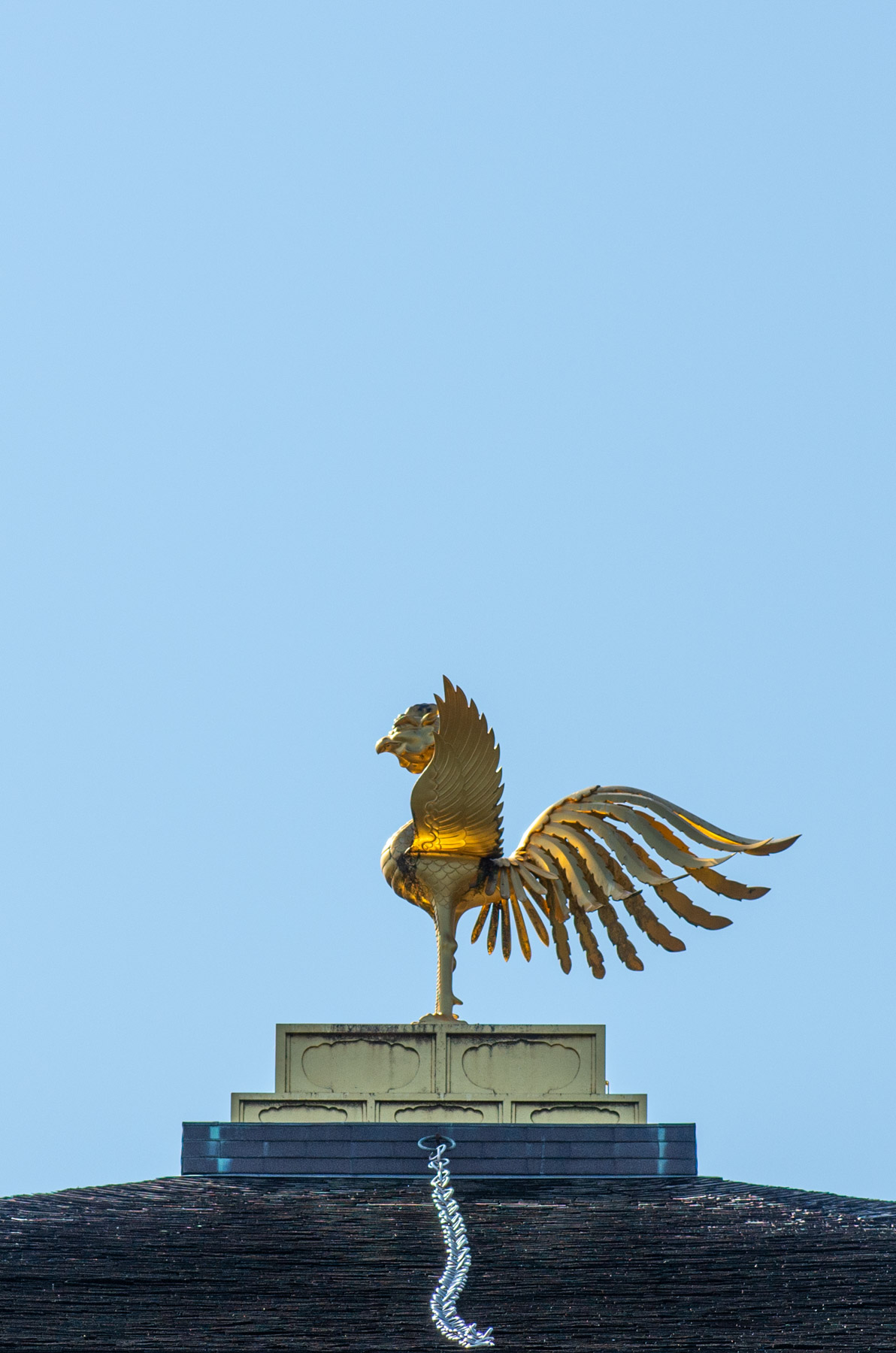 The phoenix on top of the pavilion.