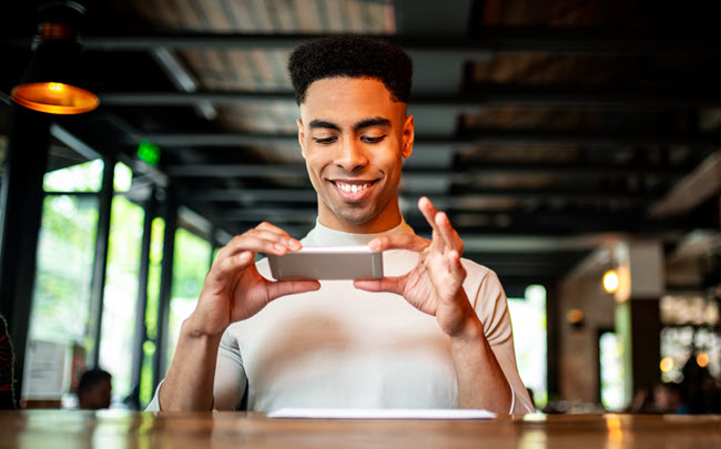 Depositing a payment cheque using a mobile banking app.